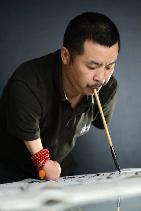 斷臂人張文佑書法欣賞